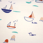 Tissu cotonnade blanc aux petits bateaux bleus et oranges - STANDARD 100 OEKO - TEX - tissuspipi.com