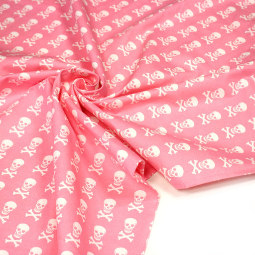 Tissu popeline coton enfant, les têtes de pirate blanc, fond rose - tissuspipi.com