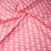 Tissu popeline coton enfant, les têtes de pirate blanc, fond rose - tissuspipi.com
