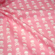 Tissu popeline coton enfant, les têtes de pirate blanc, fond rose - tissuspipi.com