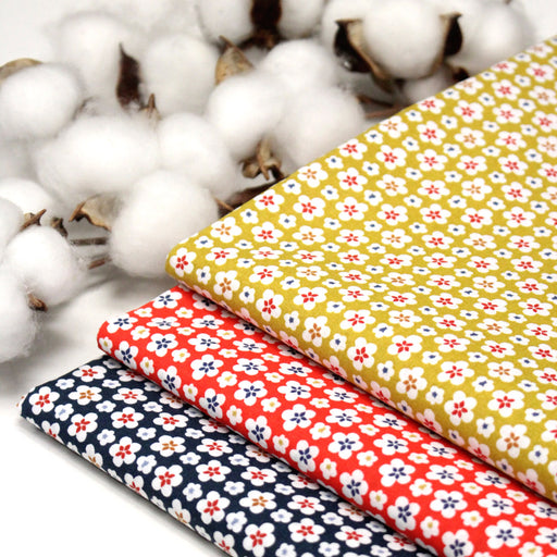 Tissu cotonnade fleurs japonaises géométriques : bleu, jaune, vert, rouge - OEKO - TEX - tissuspipi.com