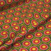 Tissu cotonnade aux fleurs SEVENTIES roses jaunes et rouges, fond kaki - OEKO-TEX STANDARD 100 - tissuspipi.com