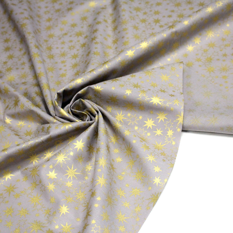Tissu coton Noël, gris aux étoiles dorées - tissuspipi.com