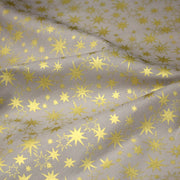 Tissu coton Noël, gris aux étoiles dorées - tissuspipi.com