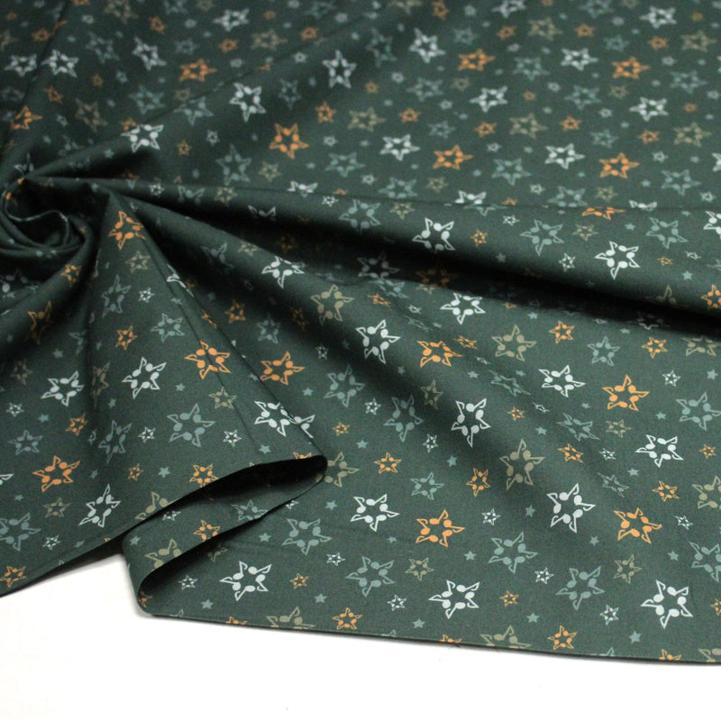 Tissu cotonnade vert aux notes de musique en étoiles - STANDARD 100 OEKO - TEX - tissuspipi.com