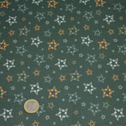 Tissu cotonnade vert aux notes de musique en étoiles - STANDARD 100 OEKO - TEX - tissuspipi.com