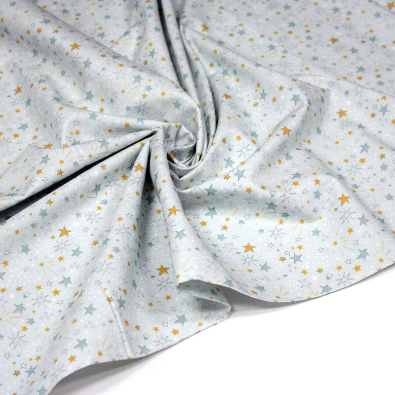 Tissu cotonnade bleu ciel aux étoiles bleues et jaunes - STANDARD 100 OEKO - TEX - tissuspipi.com