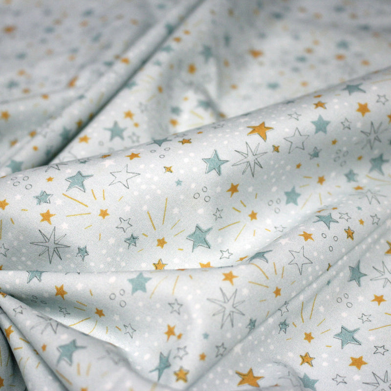 Tissu cotonnade bleu ciel aux étoiles bleues et jaunes - STANDARD 100 OEKO - TEX - tissuspipi.com