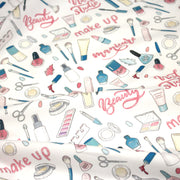 Tissu cotonnade MAKE - UP GIRLY, motifs maquillages et parfums, tons roses, bleus, écrus - tissuspipi.com