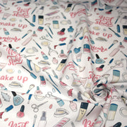 Tissu cotonnade MAKE - UP GIRLY, motifs maquillages et parfums, tons roses, bleus, écrus - tissuspipi.com