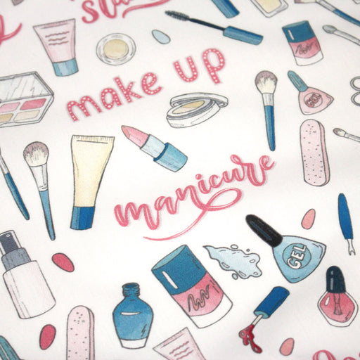 Tissu cotonnade MAKE - UP GIRLY, motifs maquillages et parfums, tons roses, bleus, écrus - tissuspipi.com