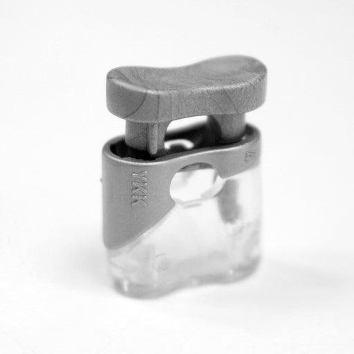 Bloque cordon YKK - Stop cordon gris clair & transparent, 1 trou, YKK - tissuspipi.com
