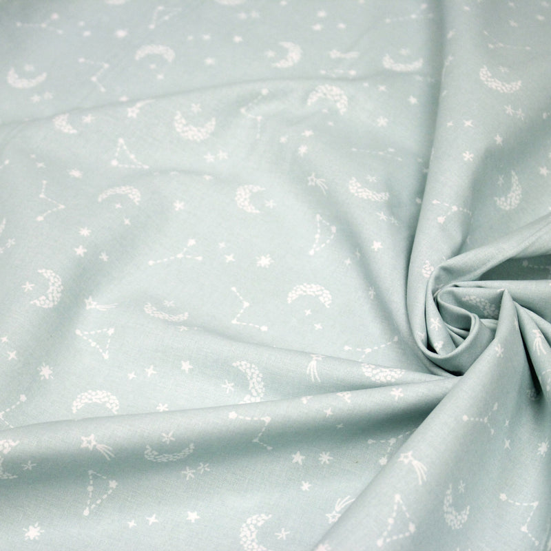 Tissu cotonnade enfant, constellation blanche, lune et étoiles fond vert clair - OEKO - TEX STANDARD 100 - tissuspipi.com