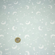 Tissu cotonnade enfant, constellation blanche, lune et étoiles fond vert clair - OEKO - TEX STANDARD 100 - tissuspipi.com