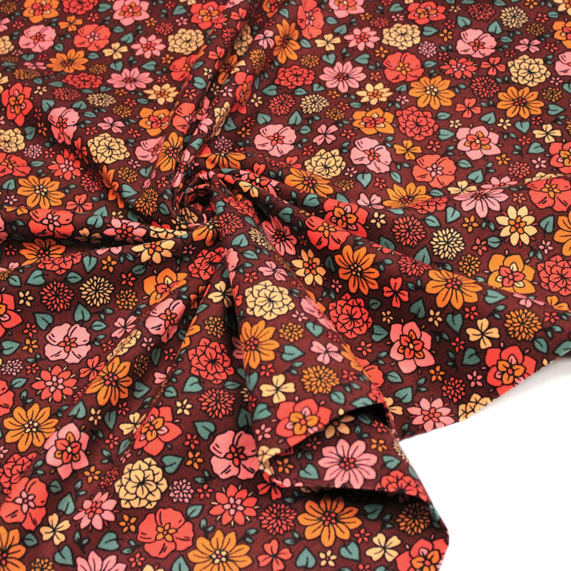 Tissu velours milleraies imprimé SEVENTIES choco aux fleurs rouge roses oranges - STANDARD 100 OEKO-TEX - tissuspipi.com