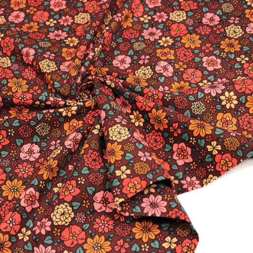 Tissu velours milleraies imprimé SEVENTIES choco aux fleurs rouge roses oranges - STANDARD 100 OEKO-TEX - tissuspipi.com