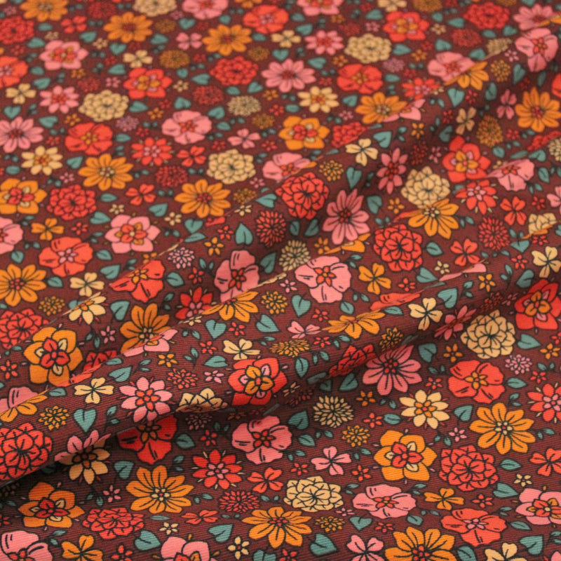 Tissu velours milleraies imprimé SEVENTIES choco aux fleurs rouge roses oranges - STANDARD 100 OEKO-TEX - tissuspipi.com