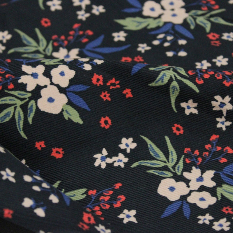 Tissu velours milleraies imprimé noir aux fleurs écrues, bleues, vertes - STANDARD 100 OEKO-TEX - tissuspipi.com