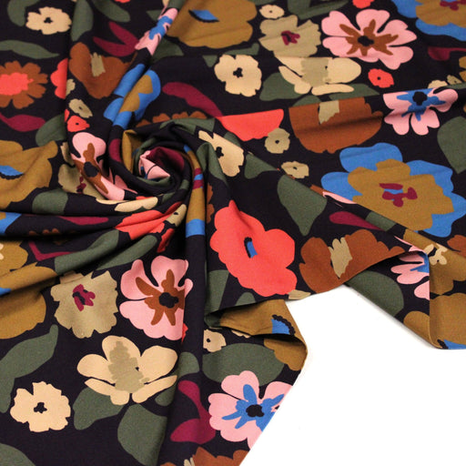Tissu Viscose fluide fleurs graphiques rétro multicolores, fond noir – STANDARD 100 OEKO-TEX - tissuspipi.com