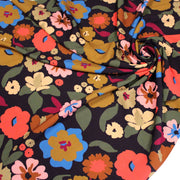 Tissu Viscose fluide fleurs graphiques rétro multicolores, fond noir – STANDARD 100 OEKO-TEX - tissuspipi.com