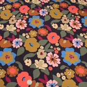 Tissu Viscose fluide fleurs graphiques rétro multicolores, fond noir – STANDARD 100 OEKO-TEX - tissuspipi.com
