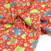 Tissu cotonnade SEVENTIES rouge et formes psychédéliques oranges, bleues, vertes - tissuspipi.com