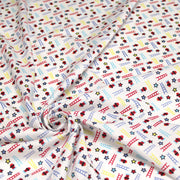 Tissu cotonnade enfant motif pompiers, échelles et étoiles multicolores sur fond blanc - tissuspipi.com