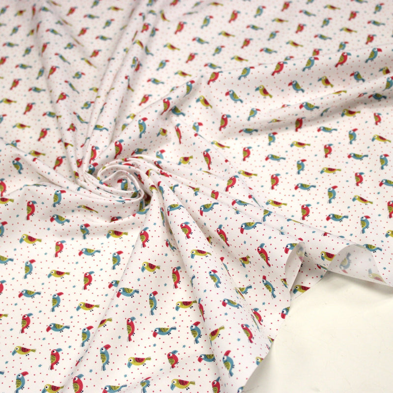 Tissu cotonnade enfant aux petits toucans multicolores sur fond blanc - tissuspipi.com