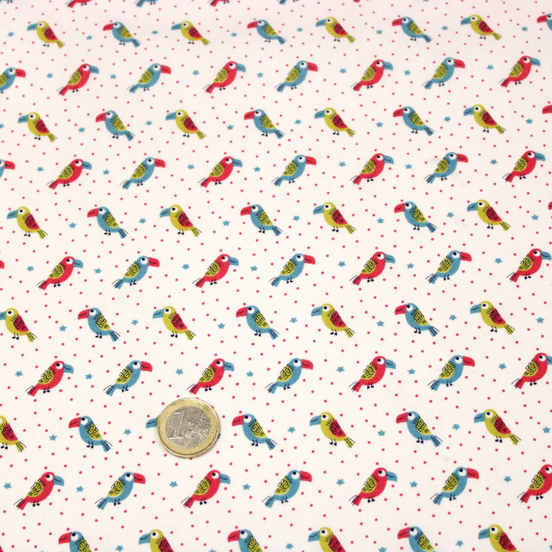 Tissu cotonnade enfant aux petits toucans multicolores sur fond blanc - tissuspipi.com