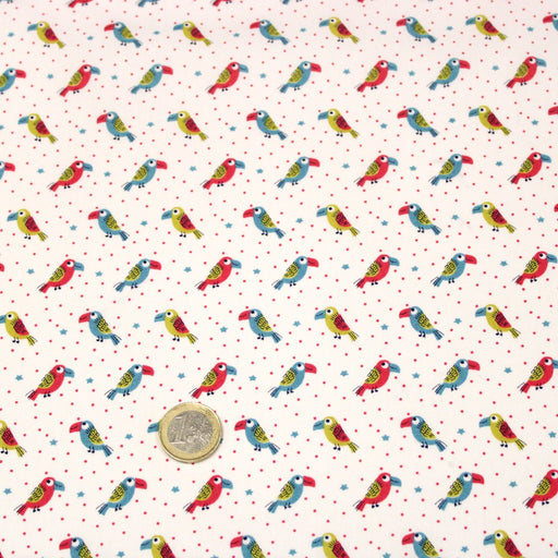 Tissu cotonnade enfant aux petits toucans multicolores sur fond blanc - tissuspipi.com