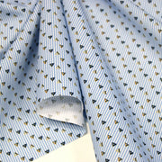 Tissu cotonnade enfant à fines rayures bleu ciel et petits triangles noirs et ocre - tissuspipi.com