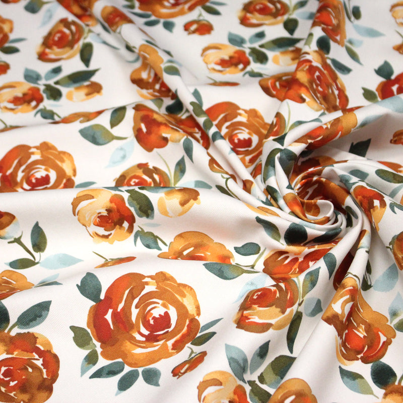 Tissu gabardine coton imprimée blanc aux roses oranges façon aquarelle - tissuspipi.com