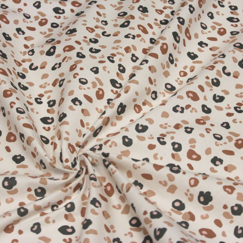 Tissu cotonnade LEOPARD, écru et taches léopard noires, roses, ocres - OEKO - TEX STANDARD 100 - tissuspipi.com