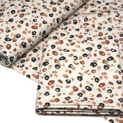 Tissu cotonnade LEOPARD, écru et taches léopard noires, roses, ocres - OEKO - TEX STANDARD 100 - tissuspipi.com