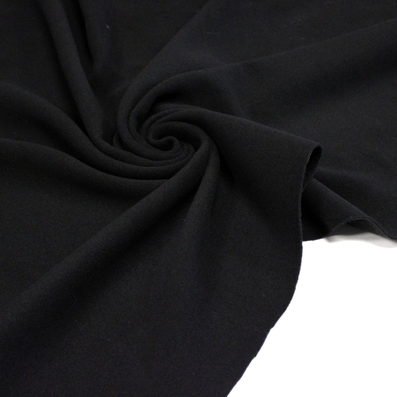 Tissu lainage épais et souple, noir uni, fabrication italienne - tissuspipi.com