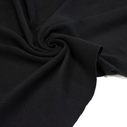 Tissu lainage épais et souple, noir uni, fabrication italienne - tissuspipi.com