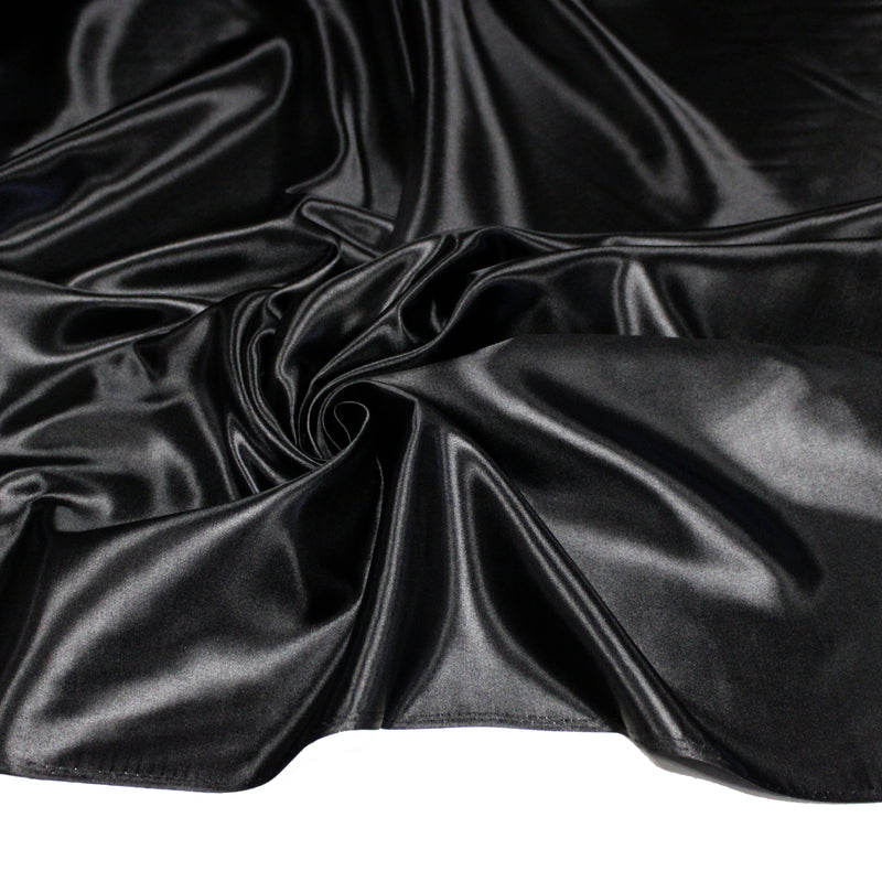 Tissu satin polyester noir uni, fabrication italienne - tissuspipi.com