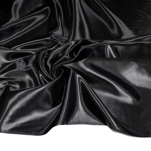 Tissu satin polyester noir uni, fabrication italienne - tissuspipi.com
