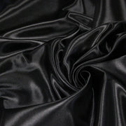 Tissu satin polyester noir uni, fabrication italienne - tissuspipi.com