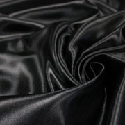 Tissu satin polyester noir uni, fabrication italienne - tissuspipi.com