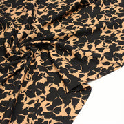Tissu viscose fluide ocre aux feuilles noires façon silhouette - OEKO-TEX STANDARD 100 - tissuspipi.com