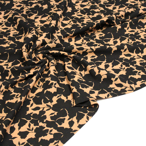 Tissu viscose fluide ocre aux feuilles noires façon silhouette - OEKO-TEX STANDARD 100 - tissuspipi.com