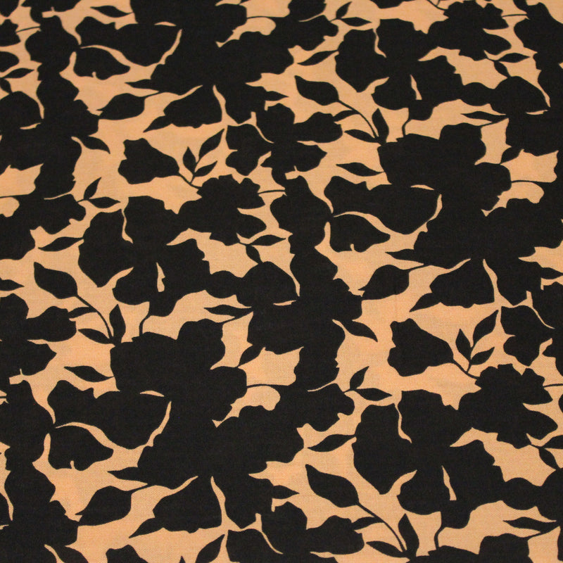 Tissu viscose fluide ocre aux feuilles noires façon silhouette - OEKO-TEX STANDARD 100 - tissuspipi.com