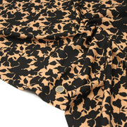 Tissu viscose fluide ocre aux feuilles noires façon silhouette - OEKO-TEX STANDARD 100 - tissuspipi.com