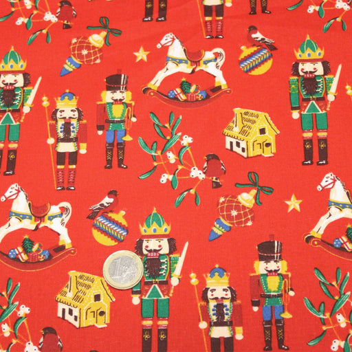 Tissu cotonnade de NOËL – Casse-noisettes et jouets d’antan, fond rouge - OEKO-TEX STANDARD 100 - tissuspipi.com