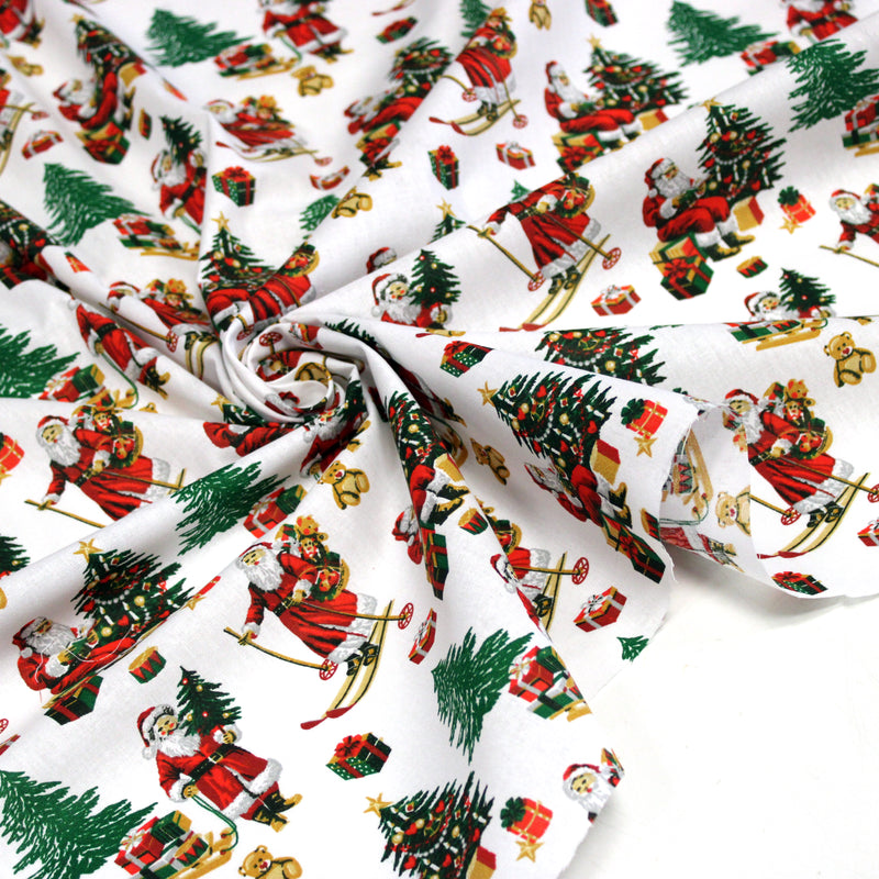Tissu cotonnade de NOËL, le père Noël à ski, fond blanc - OEKO-TEX STANDARD 100