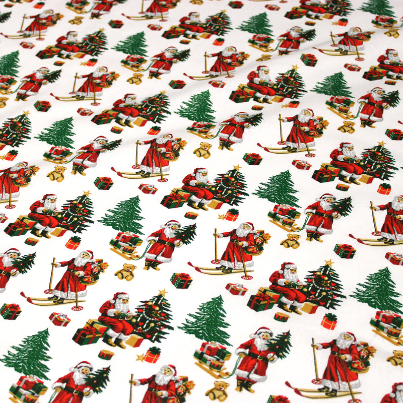 Tissu cotonnade de NOËL, le père Noël à ski, fond blanc - OEKO-TEX STANDARD 100