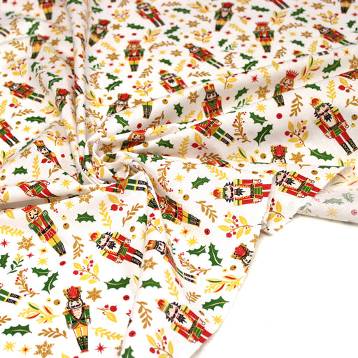 Tissu cotonnade de NOËL, Casse-noisettes, houx et feuillages ocres, fond blanc - OEKO-TEX STANDARD 100 - tissuspipi.com