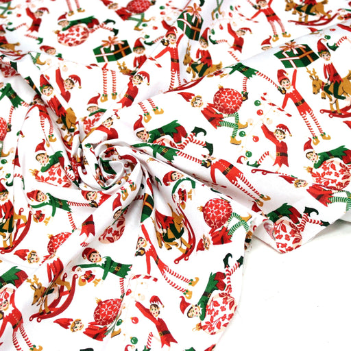 Tissu cotonnade de NOËL – La farandole des lutins, fond blanc - OEKO-TEX STANDARD 100 - tissuspipi.com