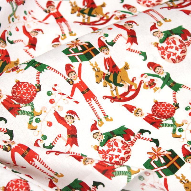 Tissu cotonnade de NOËL – La farandole des lutins, fond blanc - OEKO-TEX STANDARD 100 - tissuspipi.com